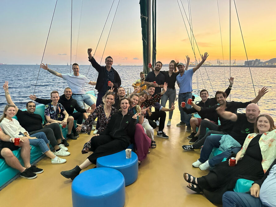Resource Guru's team on a boat on the Mediterranean. 